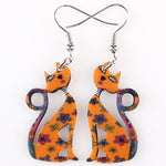Brincos artísticos gato laranja valor por defeito título