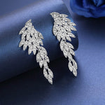 Brincos asa de anjo com strass or-blanc