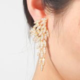 Brincos asa de anjo com strass