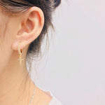 Brincos femininos cruz em metal dourado