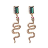 Brincos serpente strass valor por defeito título