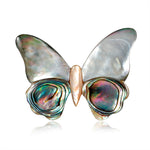 Broche borboleta cinzento