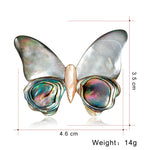 Broche borboleta cinzento