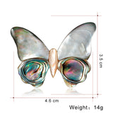 Broche borboleta cinzento