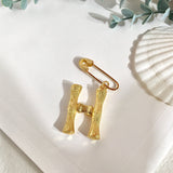 Broche inicial h