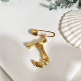 Broche inicial j