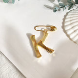 Broche inicial k