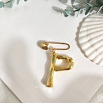 Broche inicial p