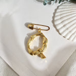 Broche inicial