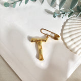 Broche inicial t