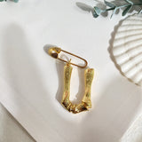 Broche inicial u