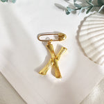 Broche inicial x