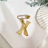 Broche inicial x