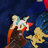 Broche leão branco