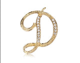 Broche letra d