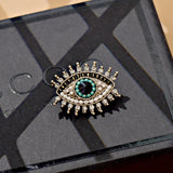 Broche olho