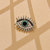Broche olho