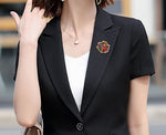Broche strass ouro