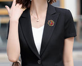 Broche strass ouro
