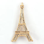 Broche torre eiffel ouro
