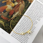 Colar dourado de pérolas pulseira