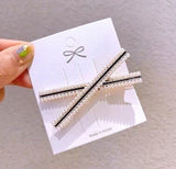Conjunto de 2 ganchos de cabelo valor por defeito título
