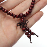 Pulseira budista de madeira valor por defeito título