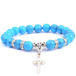 Pulseira com cruz e pérolas naturais azul turquesa