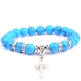 Pulseira com cruz e pérolas naturais azul turquesa