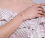 Pulseira com cruz pérolas azuis valor por defeito título