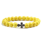 Pulseira com cruz pérolas de pedra amarelo