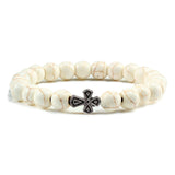 Pulseira com cruz pérolas de pedra branco