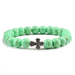Pulseira com cruz pérolas de pedra verde claro