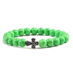 Pulseira com cruz pérolas de pedra verde
