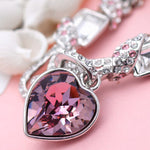 Pulseira com pendente de coração rosa tipo