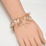 Pulseira conchas da moda título por defeito