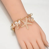 Pulseira conchas da moda título por defeito