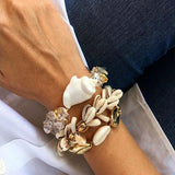 Pulseira conchas do taiti título por defeito