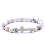 Pulseira cruz com pérolas brancas valor por defeito título