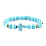 Pulseira cruz minimalista azul celeste/dourado