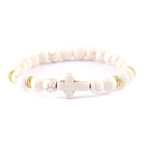 Pulseira cruz minimalista porcelana branca/dourada