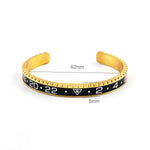 Pulseira rígida desportiva ouro e preto / 62 mm