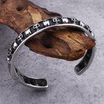 Pulseira rígida ossos e caveira prata